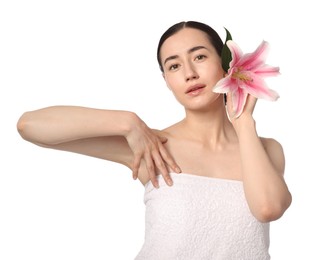Photo of Portrait of beautiful woman with lily flower after spa treatment on white background