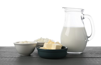 Photo of Different dairy products on grey wooden table against white background