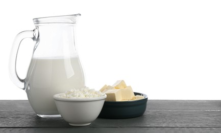 Photo of Different dairy products on grey wooden table against white background