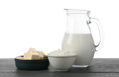 Photo of Different dairy products on grey wooden table against white background