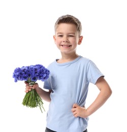 Photo of Smiling little boy with bouquet of beautiful cornflowers on white background