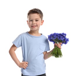 Photo of Smiling little boy with bouquet of beautiful cornflowers on white background