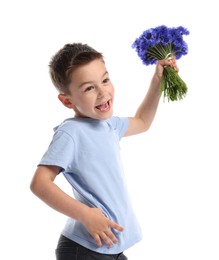 Photo of Happy little boy with bouquet of beautiful cornflowers on white background