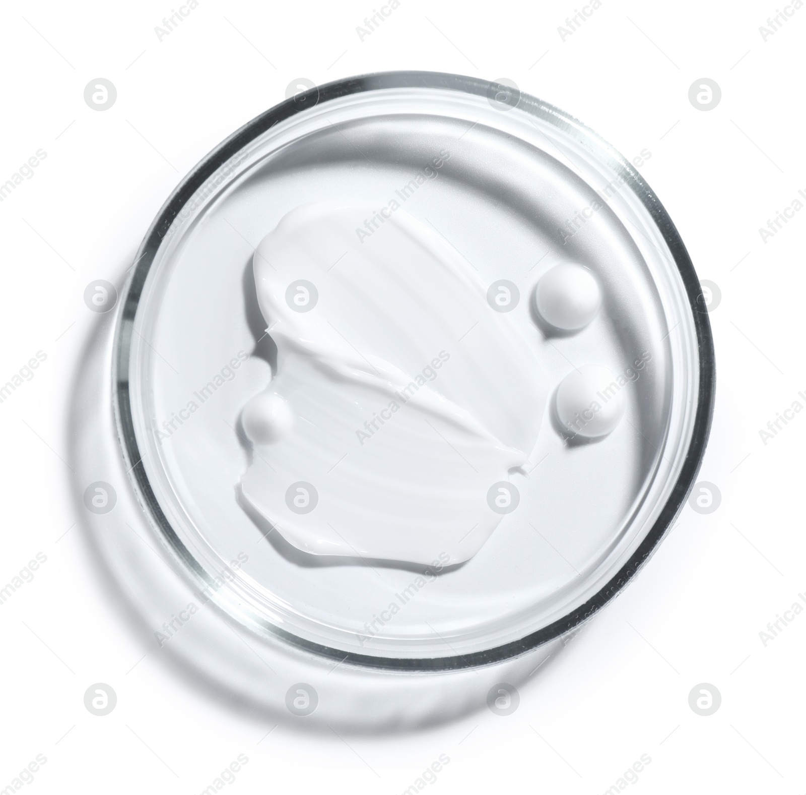 Cosmetic product in Petri dish isolated on white, top view Photo of Cosmetic product in Petri dish isolated on white, top view