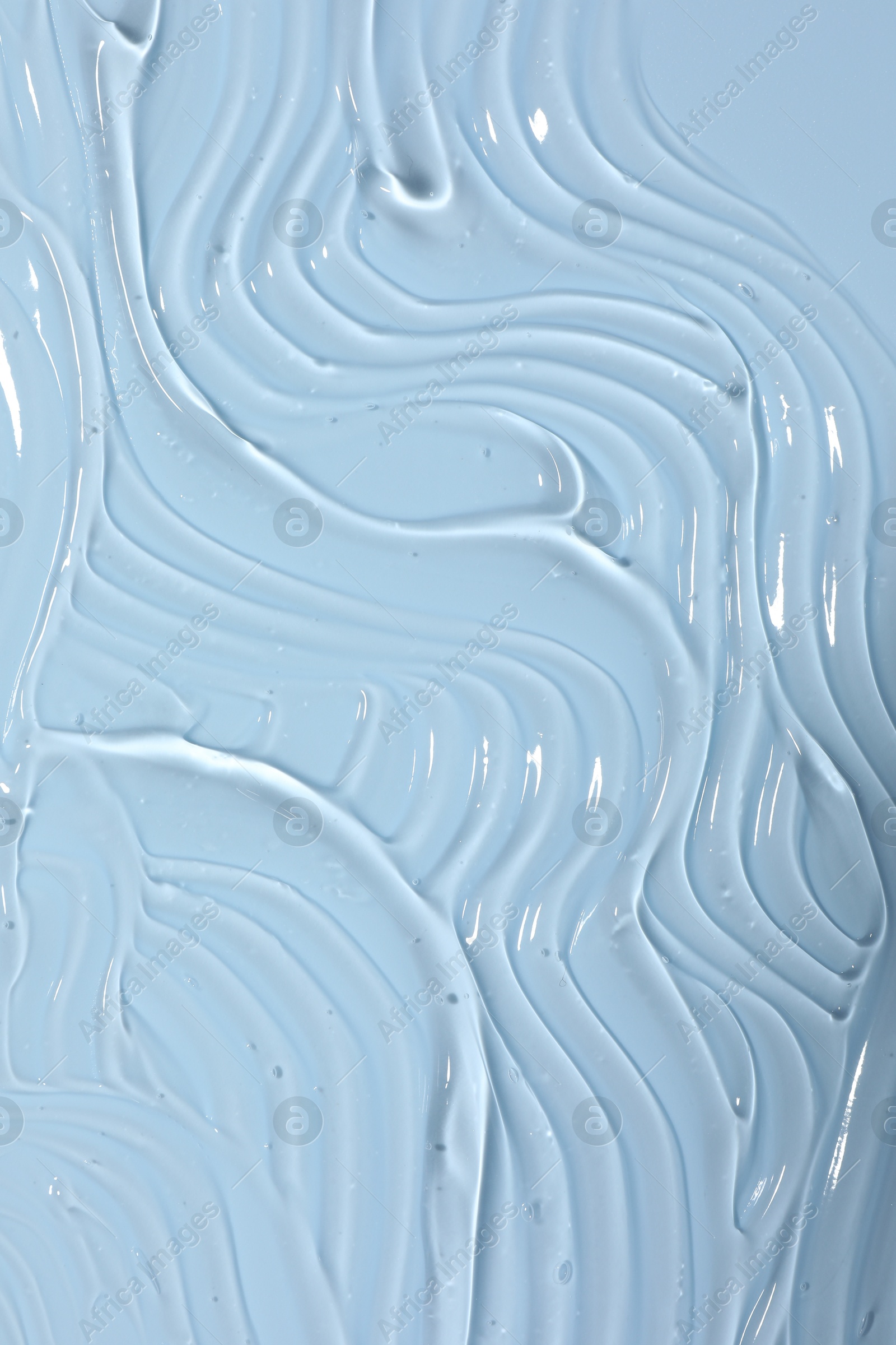 Sample of cosmetic product on light blue background, closeup Photo of Sample of cosmetic product on light blue background, closeup