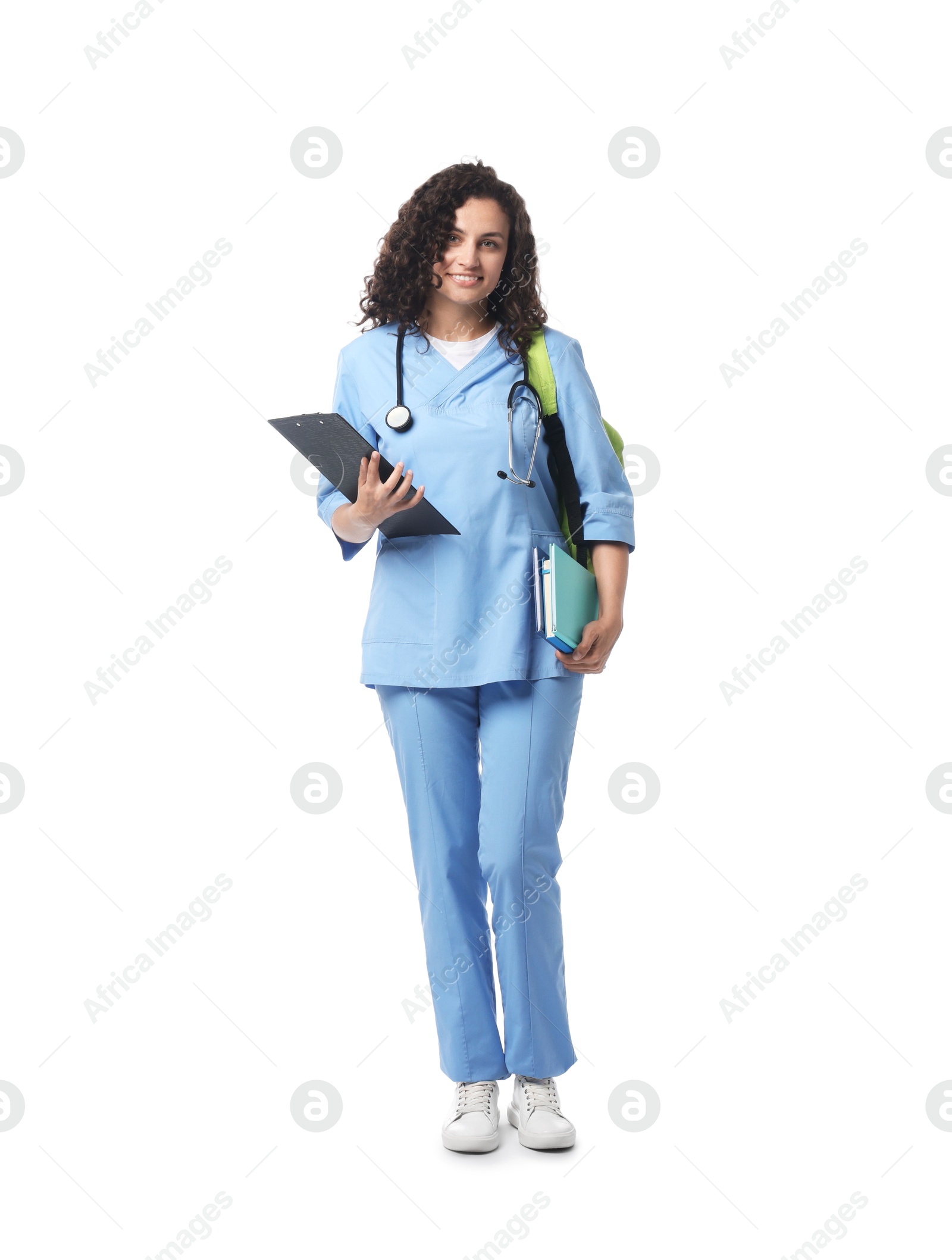 Medical student with clipboard and books on white background Photo of Medical student with clipboard and books on white background