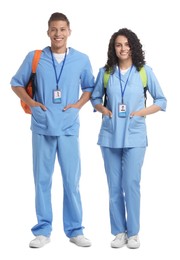 Photo of Medical students with backpacks on white background