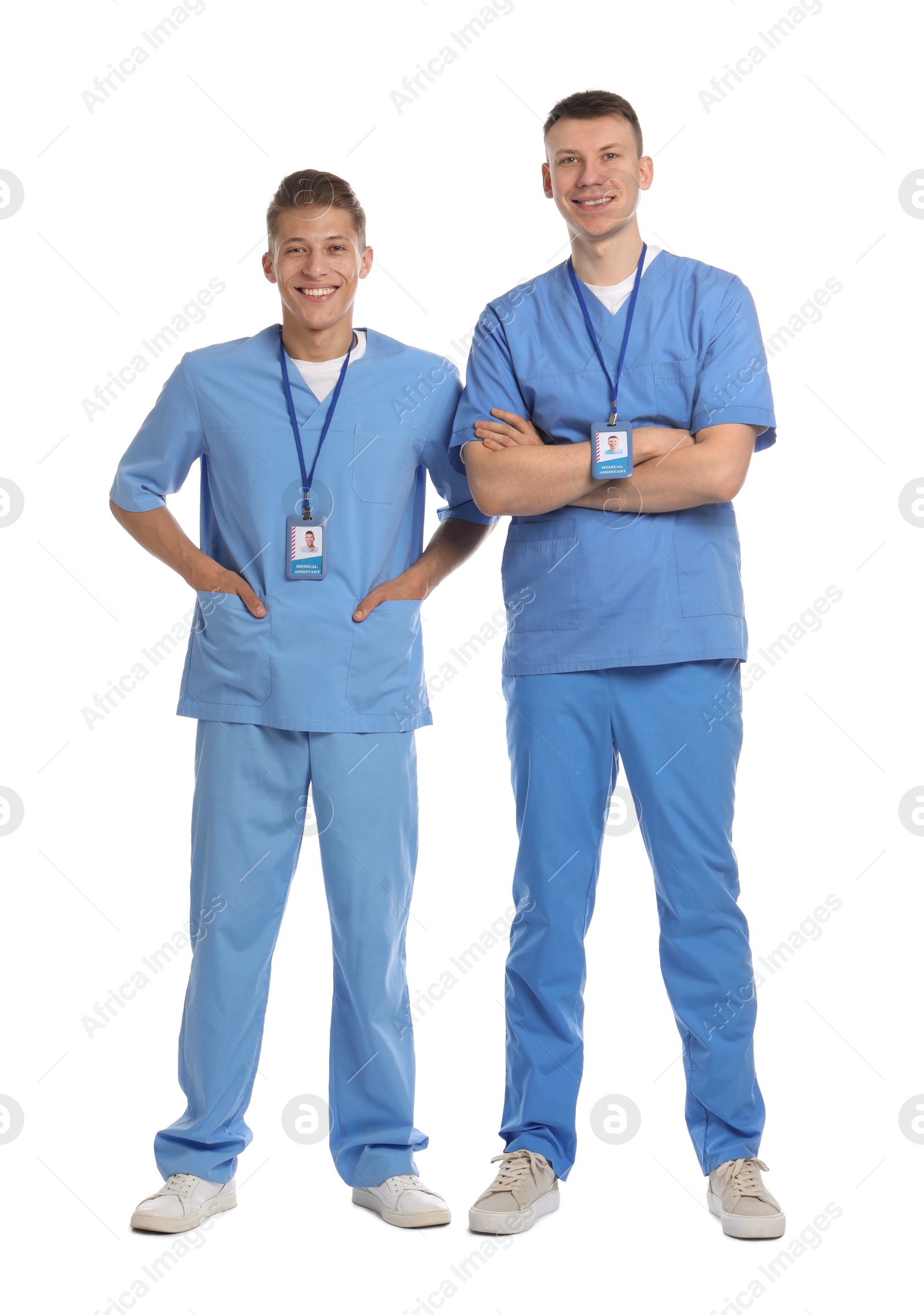 Photo of Two happy medical students on white background