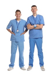 Photo of Two happy medical students on white background