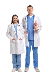 Photo of Medical students with human body model on white background