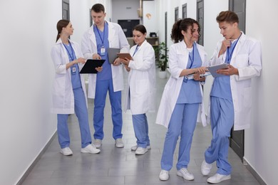 Photo of Group of medical students in uniforms indoors