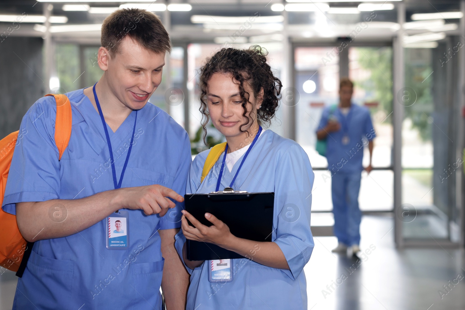 Photo of Medical students in uniforms indoors, selective focus