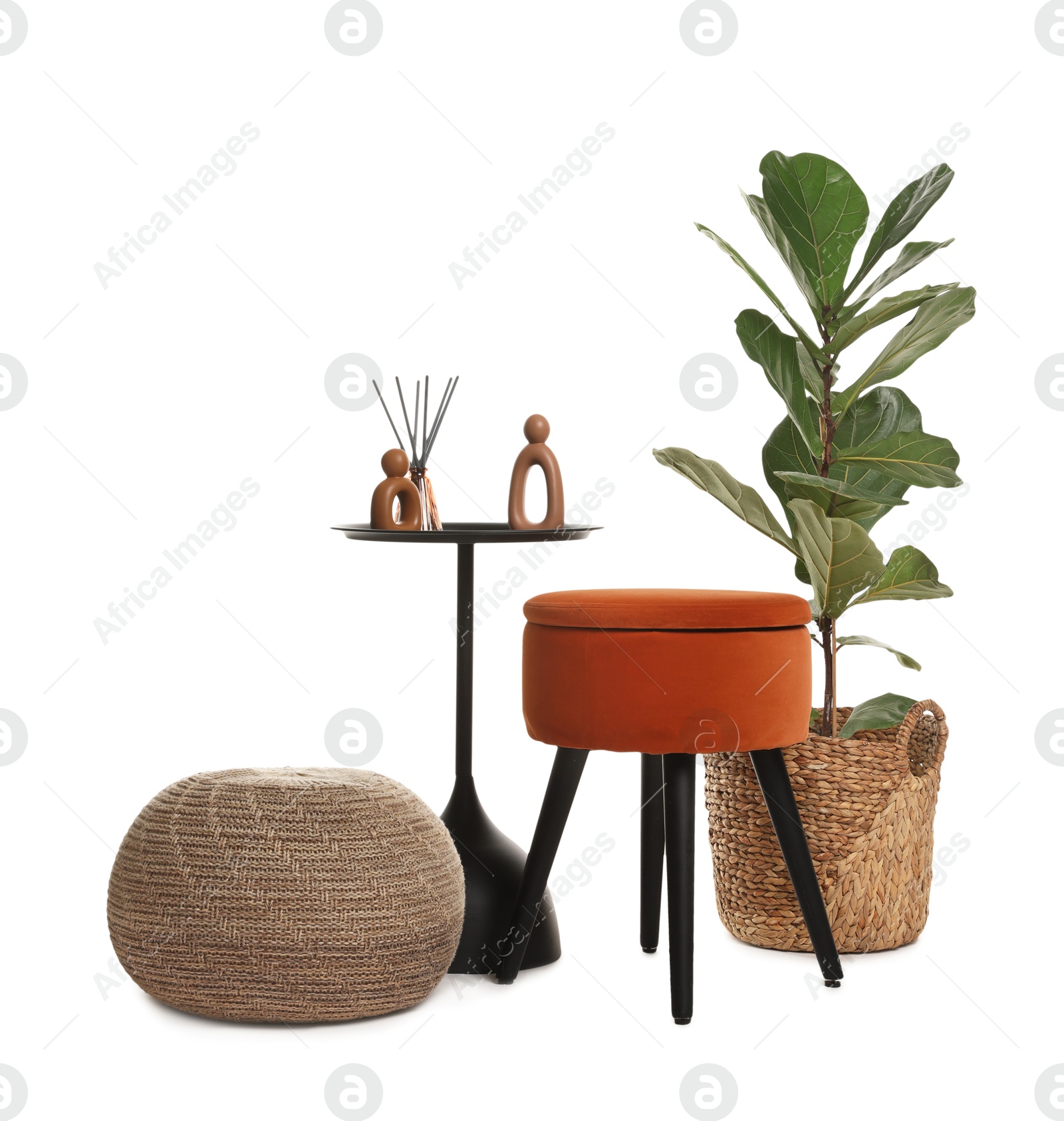 Stylish pouf and home decor isolated on white Photo of Stylish pouf and home decor isolated on white