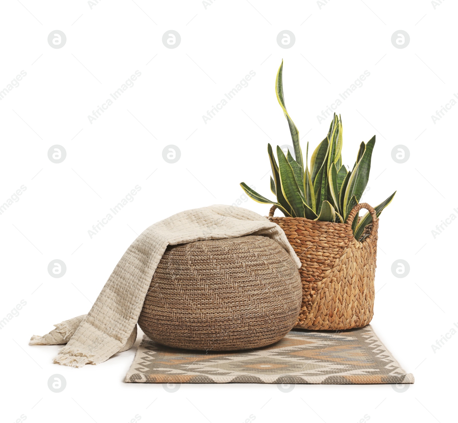 Photo of Stylish pouf and home decor isolated on white