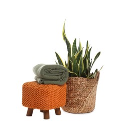 Photo of Stylish pouf with home decor isolated on white