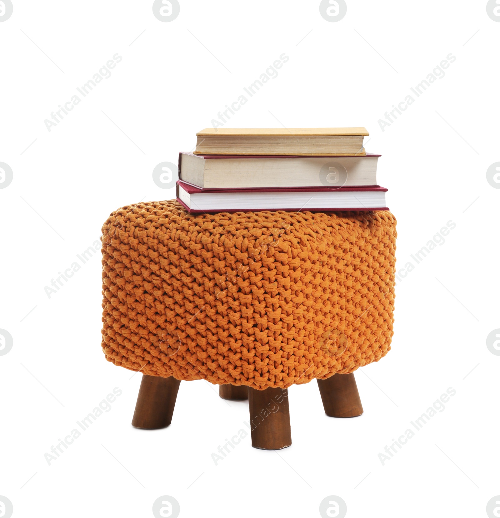 Stylish pouf with books isolated on white Photo of Stylish pouf with books isolated on white