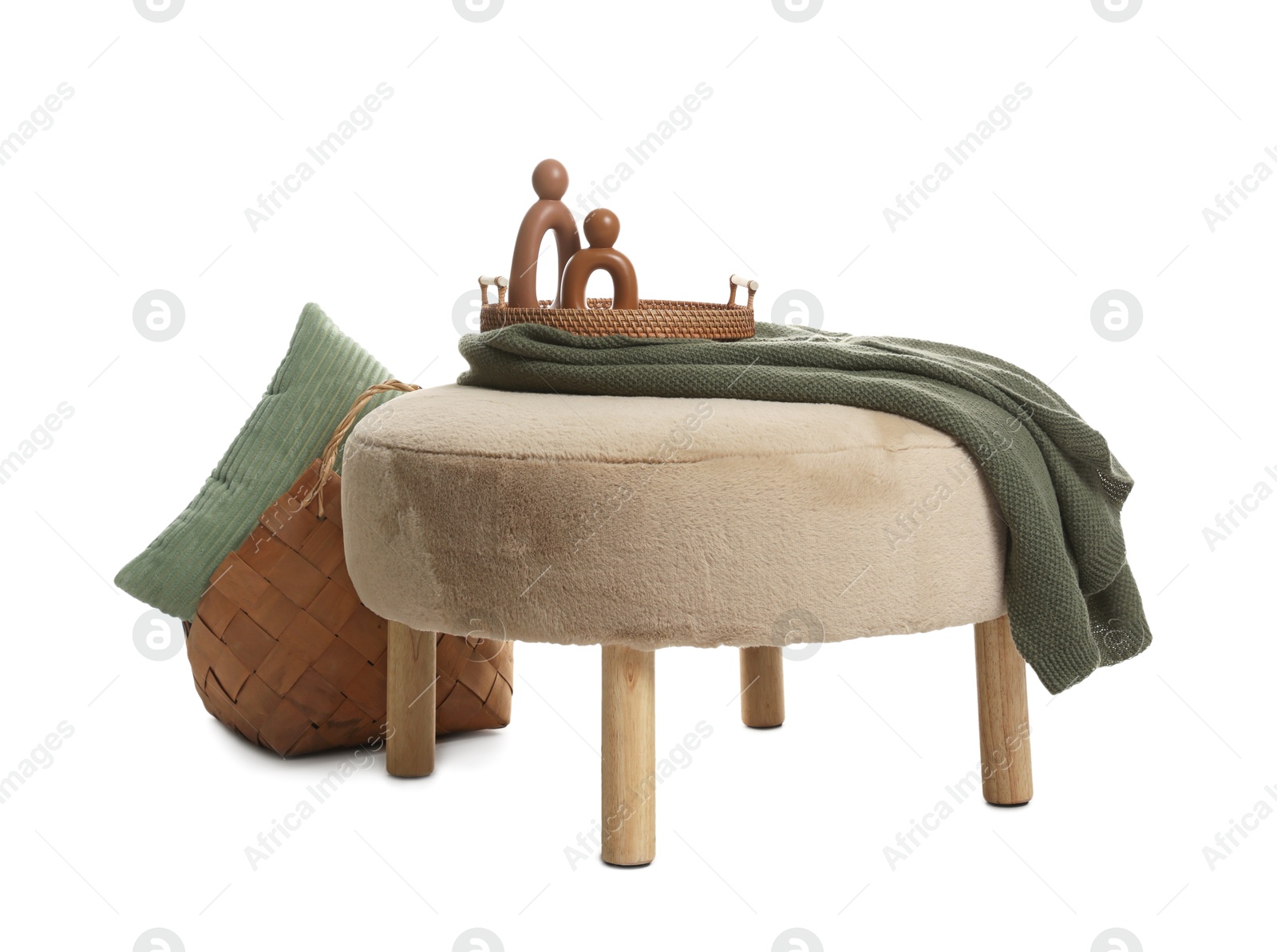 Stylish pouf and home decor isolated on white Photo of Stylish pouf and home decor isolated on white