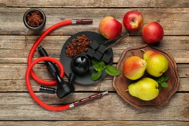 Photo of Hookah, coal and fresh fruits on wooden table, flat lay