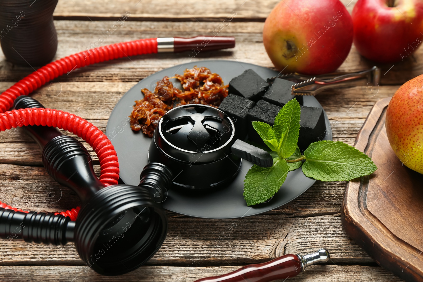 Hookah, coal and fresh fruits on wooden table, closeup Photo of Hookah, coal and fresh fruits on wooden table, closeup