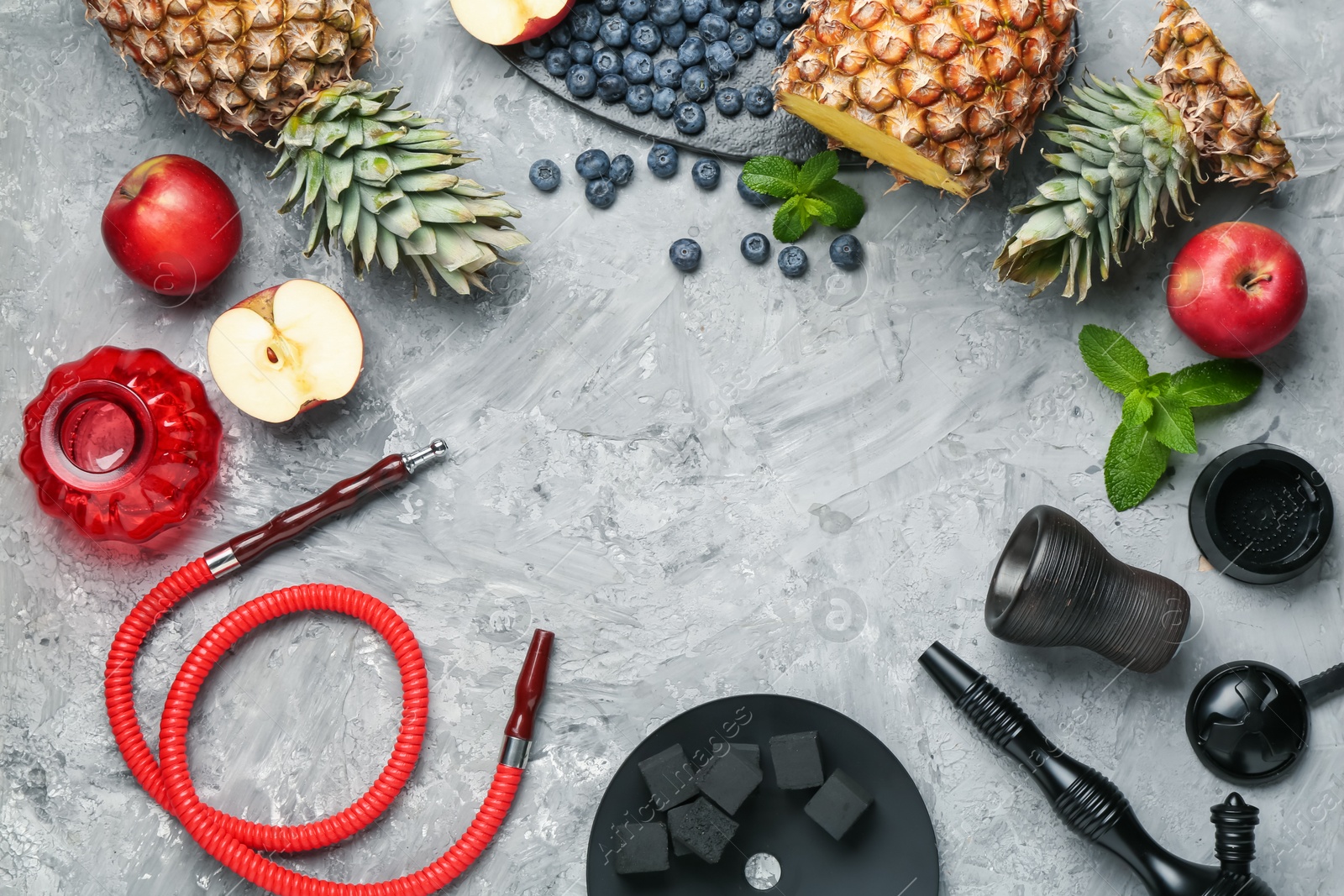 Frame of hookah and fresh fruits on grey table, flat lay. Space for text Photo of Frame of hookah and fresh fruits on grey table, flat lay. Space for text