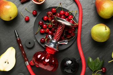 Photo of Hookah and fresh fruits on black table, flat lay