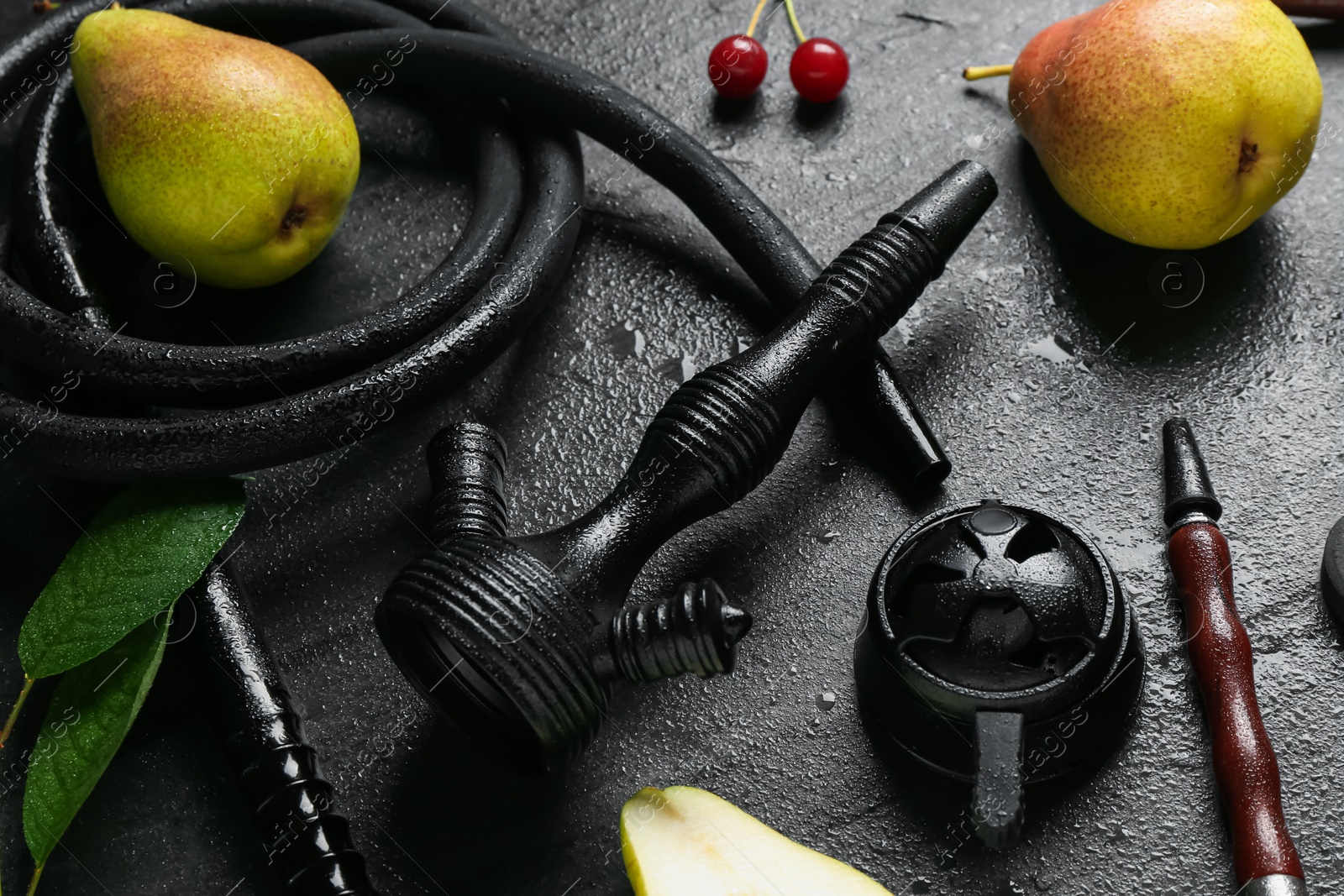 Photo of Hookah and fresh fruits on black table, closeup