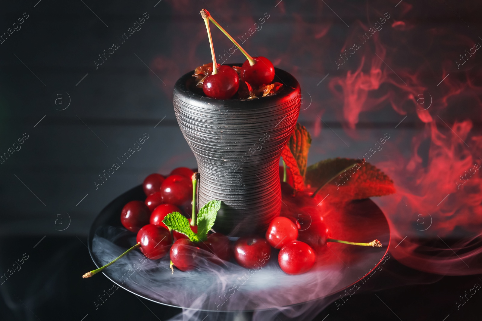 Hookah with cherries and smoke on black background, closeup Photo of Hookah with cherries and smoke on black background, closeup