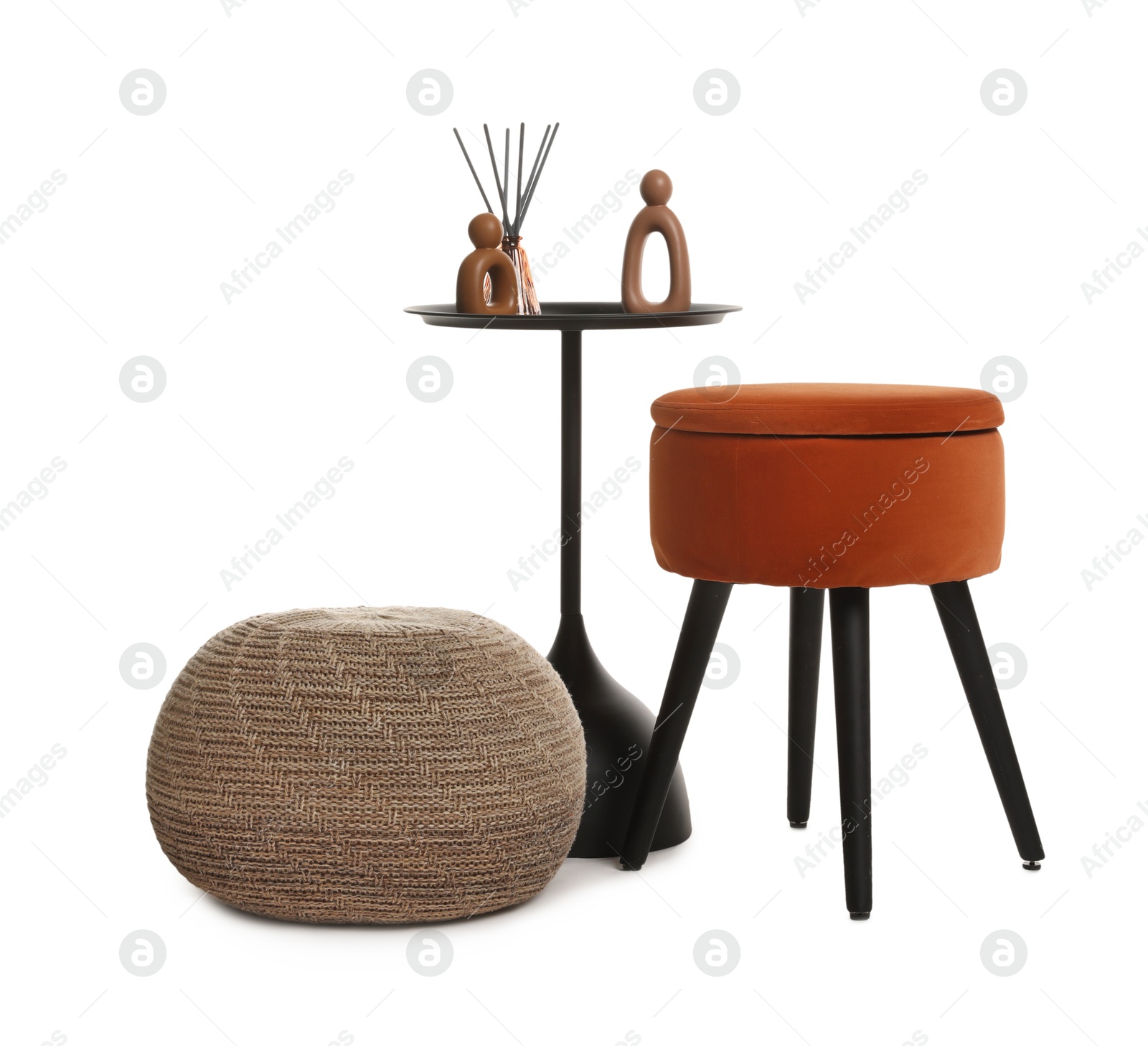 Stylish pouf and home decor isolated on white Photo of Stylish pouf and home decor isolated on white
