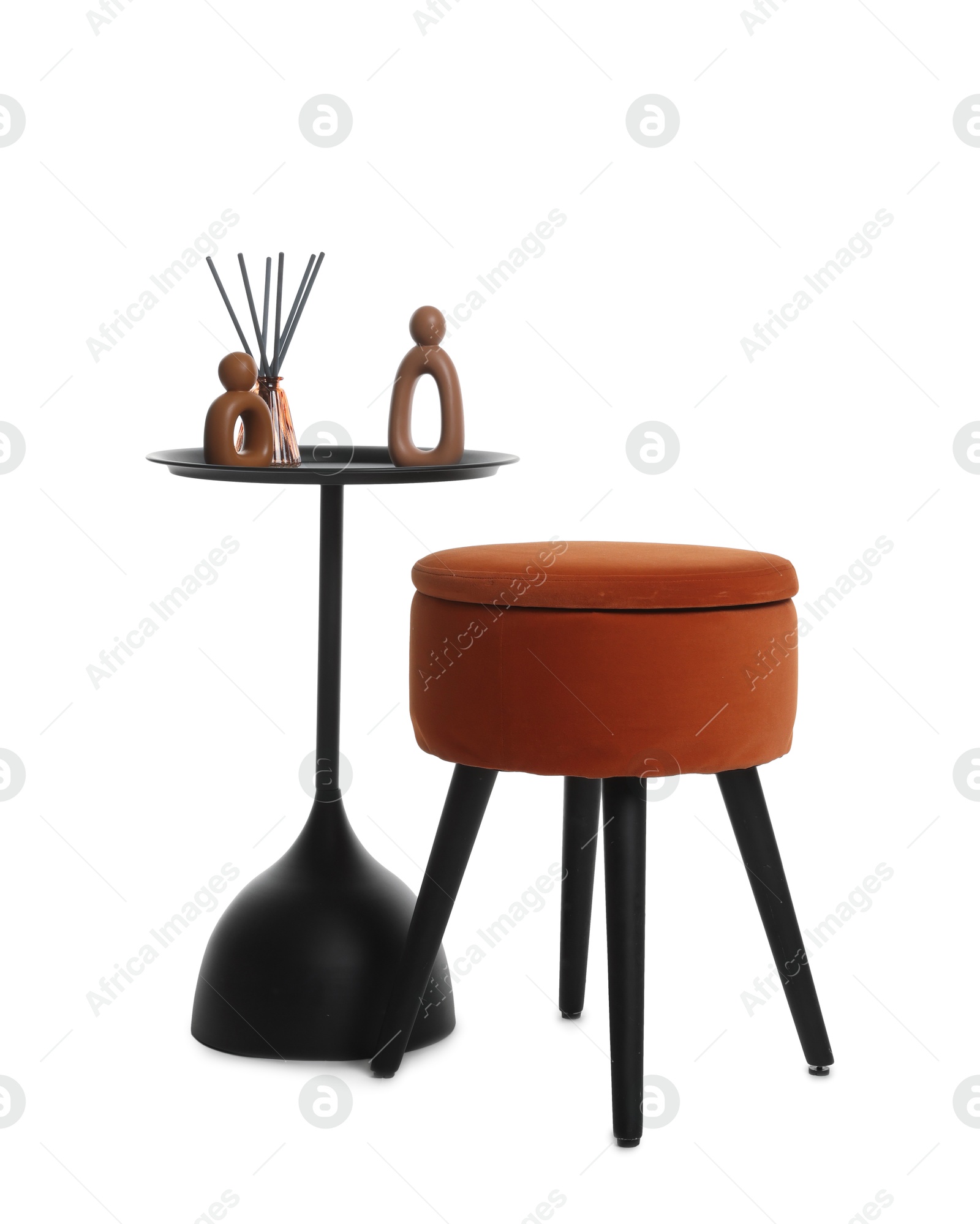 Stylish pouf and home decor isolated on white Photo of Stylish pouf and home decor isolated on white