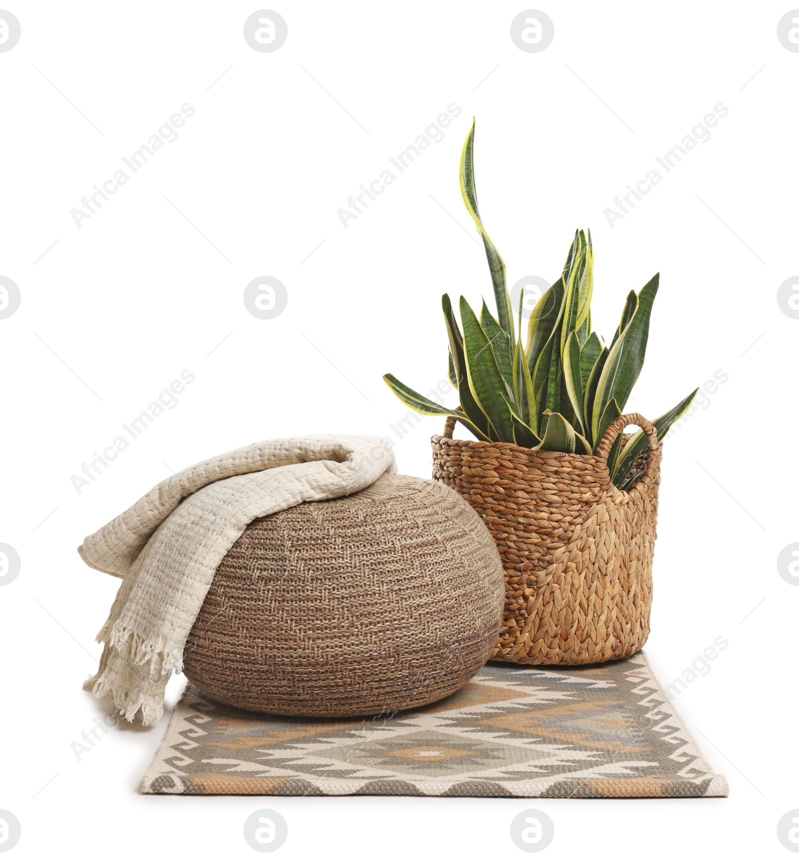 Stylish pouf and home decor isolated on white Photo of Stylish pouf and home decor isolated on white