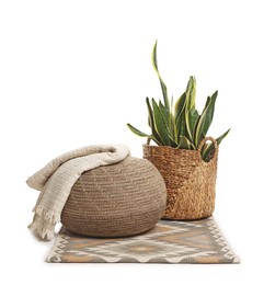 Photo of Stylish pouf and home decor isolated on white