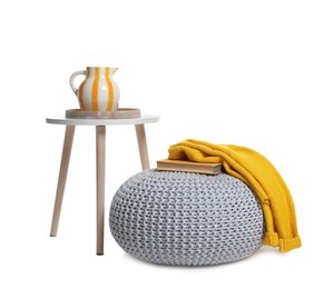 Photo of Stylish pouf and home decor isolated on white