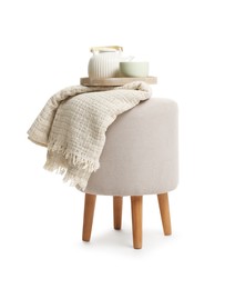 Photo of Stylish pouf with tea set and plaid isolated on white