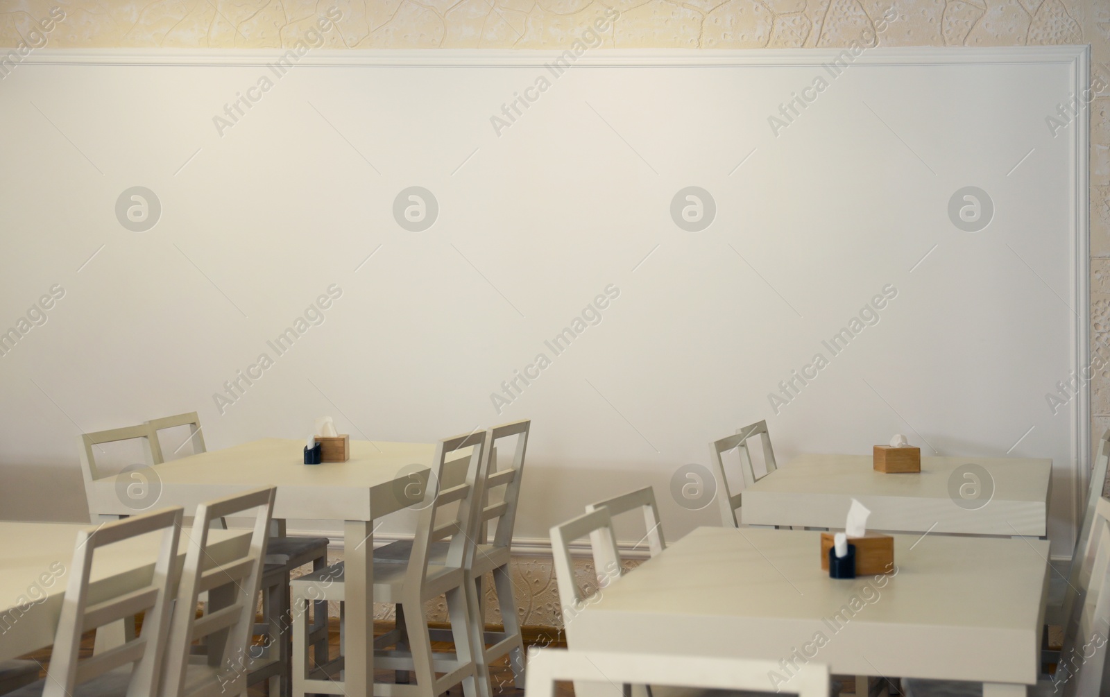 Image of Tables and chairs in cafeteria. Interior design
