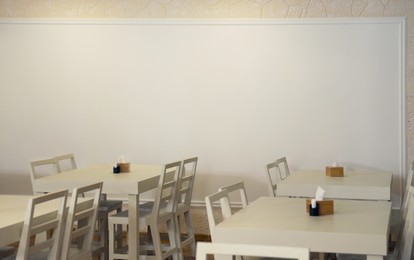 Image of Tables and chairs in cafeteria. Interior design