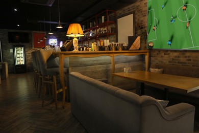 Image of Broadcasting soccer match on TV set in bar