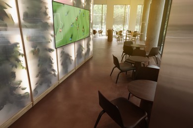 Image of Broadcasting soccer match on TV set in bar