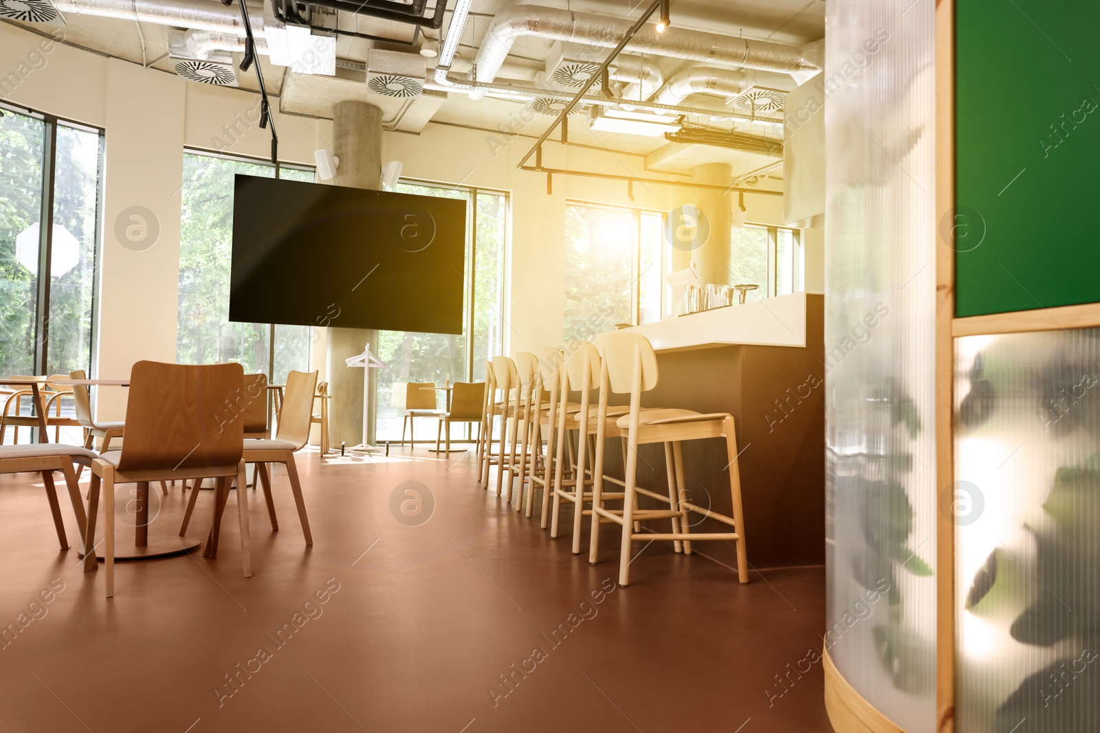 Image of TV set for event broadcasting in bar, low angle view