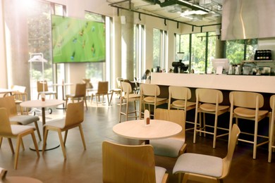 Image of Broadcasting soccer match on TV set in bar