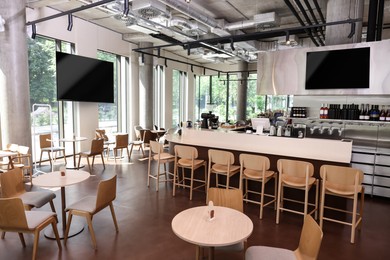 Image of TV sets for event broadcasting in bar