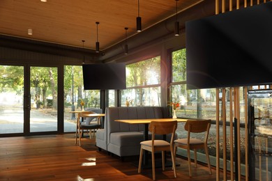 Image of TV sets for event broadcasting in bar