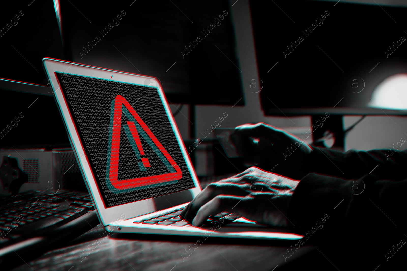 Image of Cyber attack alert notification. Red warning sign and binary code on laptop screen. Hacker using computer, closeup