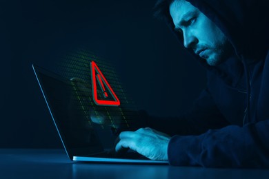 Image of Cyber attack alert notification. Red warning sign and binary code on virtual screen. Hacker using laptop