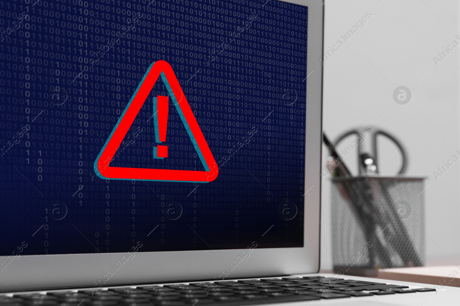 Image of Cyber attack alert notification. Red warning sign and binary code on laptop screen, closeup