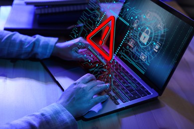 Image of Cyber attack alert notification. Red warning sign and circuit board on virtual screen. Woman using laptop, closeup