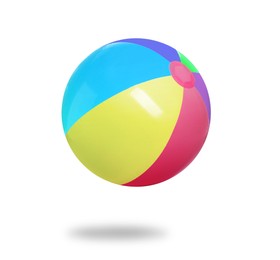 Image of Bright beach ball falling against white background