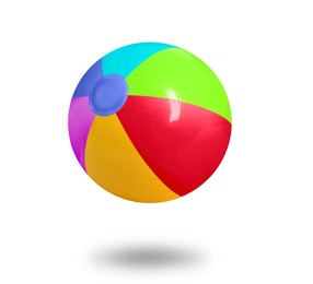 Image of Bright beach ball falling against white background