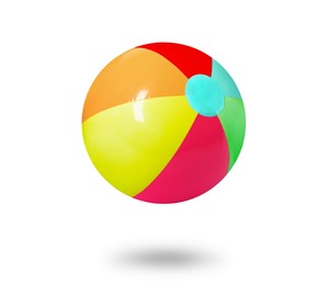 Image of Bright beach ball falling against white background