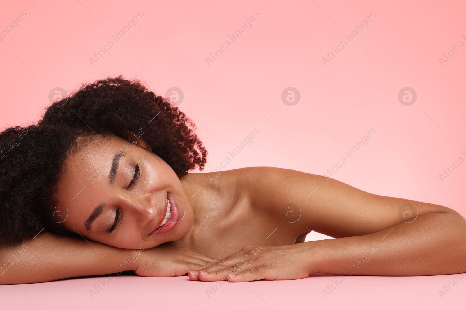 Photo of Portrait of beautiful Brazilian woman after spa treatment on pink gradient background