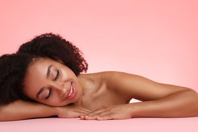 Photo of Portrait of beautiful Brazilian woman after spa treatment on pink gradient background